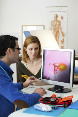 doctor-and-woman-patient-looking-at-monitor