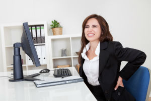 woman-at-desk-with-back-pain