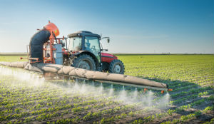 machine-spraying-pesticides-on-crops