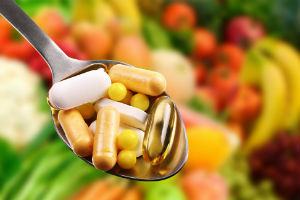 dietary-supplements-in-spoon-among-vegetables-and-fruits