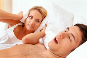 man-sleeping-snoring-woman