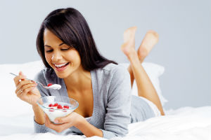 woman-eating-yogurt-berries