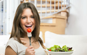 woman-eating-cherry-tomato