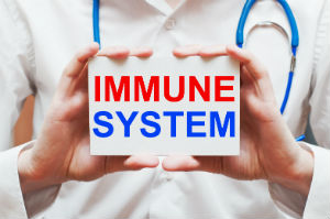doctor-holding-immune-system-card