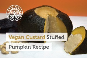 A slice of vegan custard stuffed pumpkin. This recipe is great for Halloween and much healthier than other holiday treats.