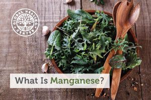 A bowl of organic green salad. Manganese is a critical mineral that is both nutritionally essential and beneficial.
