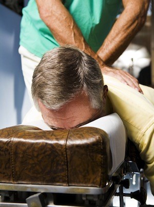 Man receiving chiropractic adjustment.