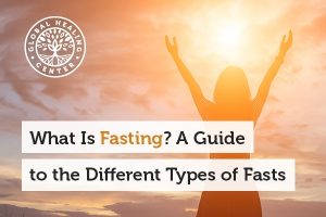 A woman staring at the sun. Understanding what fasting is and the different types can be very beneficial for your health.