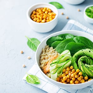 A plant-based meal in a bowl. Plant-based diets incorporate whole, natural vegetables, fruits, nuts, seeds, and grains.