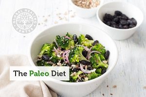 Paleo food consisting of non-starchy vegetables and seeds in a white bowl