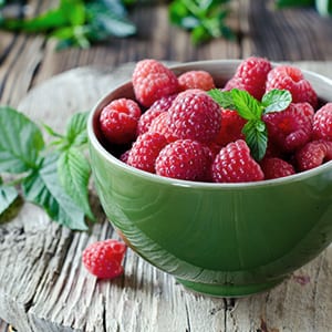 A bowl of raspberries, which is a staple for an anti-inflammatory diet.