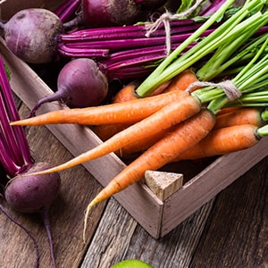 A basket of friendly gallbladder cleanse foods like beets and carrots.