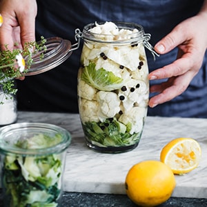 A jar of fermented vegetables, which is a healthy probiotic-rich food for your heart.
